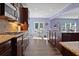 Bright kitchen showcases granite counters, gas range, dark cabinetry, and an adjacent dining area at 211 Parc Dr, Canton, GA 30114