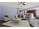 Open-concept living room offers seating, a fireplace, and views into the kitchen at 211 Parc Dr, Canton, GA 30114