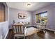 Comfortable living area with natural lighting, neutral tones, and wood flooring at 211 Parc Dr, Canton, GA 30114