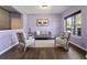 Cozy seating area with a decorative rug, gray sofa, and matching accent chairs at 211 Parc Dr, Canton, GA 30114