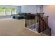 Spacious living room with carpet flooring, a staircase, and a comfortable sectional sofa at 211 Parc Dr, Canton, GA 30114