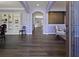 Inviting living room with dark wood floors, archways, built-in shelving, and lots of natural light at 211 Parc Dr, Canton, GA 30114