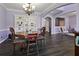Open-concept space with dining and living areas, featuring dark wood floors at 211 Parc Dr, Canton, GA 30114