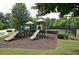 Community playground with slides, climbing structures, and plenty of space for to play at 211 Parc Dr, Canton, GA 30114
