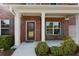 Charming front porch with white columns, brick facade, and space for outdoor seating at 211 Parc Dr, Canton, GA 30114