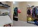 Another angle of the walk-in closet with rod and shelves for clothing and other household goods at 211 Parc Dr, Canton, GA 30114