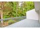 Enjoy serene outdoor living on this back deck, surrounded by lush greenery and trees for ultimate privacy at 3910 Meeting St, Duluth, GA 30096