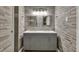 Elegant bathroom features double sinks, gray vanity, and stunning tile accents at 3910 Meeting St, Duluth, GA 30096