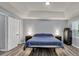 Inviting bedroom features neutral walls, an inset ceiling, and hardwood flooring at 3910 Meeting St, Duluth, GA 30096