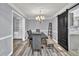 Charming dining room features gray walls, modern floors, and a stylish sliding barn door at 3910 Meeting St, Duluth, GA 30096