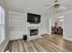 The living room showcases a marble fireplace, built in shelving, and hardwood floors at 3910 Meeting St, Duluth, GA 30096