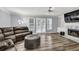Bright living room with hardwood floors, a fireplace, and ample natural light at 3910 Meeting St, Duluth, GA 30096