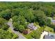 Aerial view of the house nestled among lush trees and beautiful landscaping at 4930 Forestglade Ct, Tucker, GA 30087