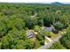 Beautiful home surrounded by mature trees in aerial view at 4930 Forestglade Ct, Tucker, GA 30087