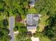 An aerial view of the well-maintained home, surrounded by dense trees and greenery at 4930 Forestglade Ct, Tucker, GA 30087