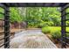 A backyard deck with an elevated pergola and lush greenery at 4930 Forestglade Ct, Tucker, GA 30087