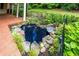 Backyard pond surrounded by rocks and lush plants, adding a touch of nature to the outdoor space at 4930 Forestglade Ct, Tucker, GA 30087