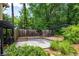Landscaped backyard with a modern patio area surrounded by lush greenery at 4930 Forestglade Ct, Tucker, GA 30087