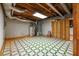 Unfinished basement with concrete flooring, exposed piping, and a water heater, offering the potential for customization at 4930 Forestglade Ct, Tucker, GA 30087