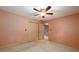 Cozy bedroom with a ceiling fan, neutral paint, and closet at 4930 Forestglade Ct, Tucker, GA 30087