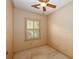 Small room with a ceiling fan and a window at 4930 Forestglade Ct, Tucker, GA 30087