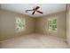 Bedroom with a ceiling fan and two windows at 4930 Forestglade Ct, Tucker, GA 30087