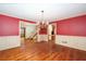 Formal dining room featuring hardwood floors and paneled walls at 4930 Forestglade Ct, Tucker, GA 30087