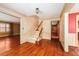 Bright foyer featuring hardwood floors, a staircase, and access to multiple rooms with decorative trim at 4930 Forestglade Ct, Tucker, GA 30087