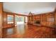 Living room featuring wood paneling, fireplace, and built-in shelves at 4930 Forestglade Ct, Tucker, GA 30087