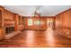 Cozy living room with wood-paneled walls and fireplace at 4930 Forestglade Ct, Tucker, GA 30087