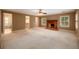 Expansive main bedroom with fireplace, shutters, neutral paint, and walk-in closet at 4930 Forestglade Ct, Tucker, GA 30087