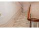Traditional carpeted staircase with decorative wood trim and a winding banister at 4930 Forestglade Ct, Tucker, GA 30087