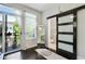 Bright bedroom with balcony access and a sliding barn door that leads to the bathroom at 1300 Dekalb Ne Ave # 731, Atlanta, GA 30307