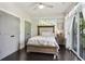 Comfortable bedroom featuring a large window with natural light, ceiling fan, and light-colored walls at 1300 Dekalb Ne Ave # 731, Atlanta, GA 30307