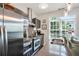 Kitchen boasts stainless steel appliances, sink, and modern decor with dark floors at 1300 Dekalb Ne Ave # 731, Atlanta, GA 30307