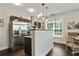Kitchen boasts stainless steel refrigerator, peninsula, and dining area with dark floors at 1300 Dekalb Ne Ave # 731, Atlanta, GA 30307