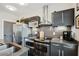 Kitchen boasts stainless steel appliances, stove, sink, and modern dark cabinets at 1300 Dekalb Ne Ave # 731, Atlanta, GA 30307