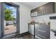 Wet bar with mini fridge offers easy access to the outdoor deck at 1300 Dekalb Ne Ave # 731, Atlanta, GA 30307