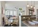 Bright living room featuring open floor plan, dining area, and modern kitchen with pendant lighting at 1300 Dekalb Ne Ave # 731, Atlanta, GA 30307