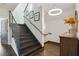 Modern staircase with metal railing, dark wood steps, and stylish lighting at 1300 Dekalb Ne Ave # 731, Atlanta, GA 30307