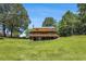 Large backyard with mature trees and a view of home's deck at 1795 Hutcheson Ferry Rd, Whitesburg, GA 30185