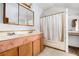 Bathroom featuring double sink vanity and shower/tub combo at 1795 Hutcheson Ferry Rd, Whitesburg, GA 30185