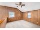 Upstairs bedroom features wood paneling and natural light at 1795 Hutcheson Ferry Rd, Whitesburg, GA 30185