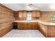 Kitchen with generous counter space, tile floors, and wood cabinets at 1795 Hutcheson Ferry Rd, Whitesburg, GA 30185