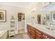 Bathroom with a large vanity, walk-in closets, soaking tub, tile floors, and great lighting at 2672 Brickell Square, Atlanta, GA 30341