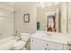 This bathroom has a shower and tub combination with white fixtures at 2672 Brickell Square, Atlanta, GA 30341