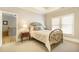 This bedroom features a brass bed, a window, and a decorative lamp on a side table at 2672 Brickell Square, Atlanta, GA 30341