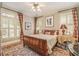Comfortable bedroom features wood floors, paneled windows with blinds, and neutral wall color at 2672 Brickell Square, Atlanta, GA 30341