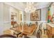 Bright dining room with a chandelier, large table and chairs, and built-in storage at 2672 Brickell Square, Atlanta, GA 30341