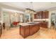 Gourmet kitchen with granite countertops, stainless steel appliances, a kitchen island, and breakfast area at 2672 Brickell Square, Atlanta, GA 30341